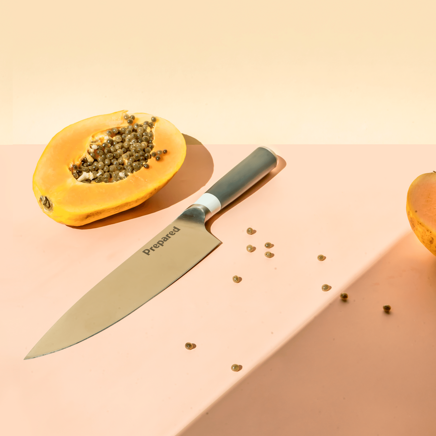 The Chef's knife and half of a papaya